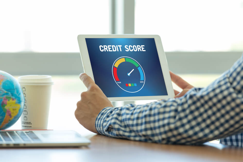 Man Looking at Credit Score Application on a Screen